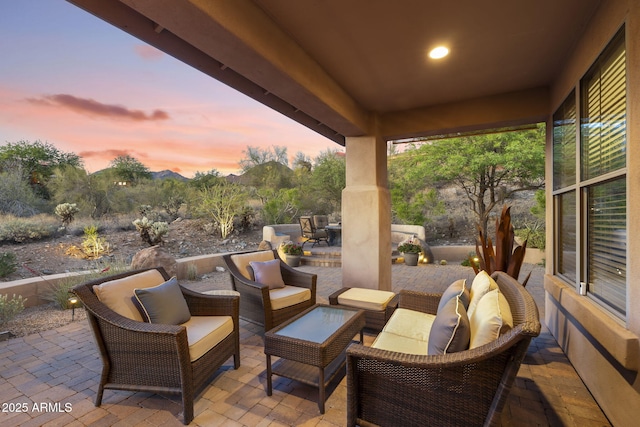 11400 E Helm Dr, Scottsdale, AZ 85255 - patio terrace at dusk featuring an outdoor living space