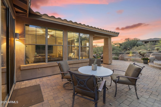 11400 E Helm Dr, Scottsdale, AZ 85255 - patio terrace at dusk featuring outdoor dining space