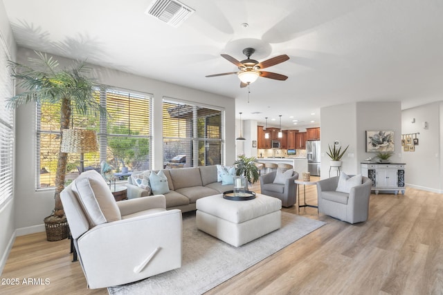 11400 E Helm Dr, Scottsdale, AZ 85255 - living room featuring ceiling fan, light wood-type flooring, baseboards, and recessed lighting