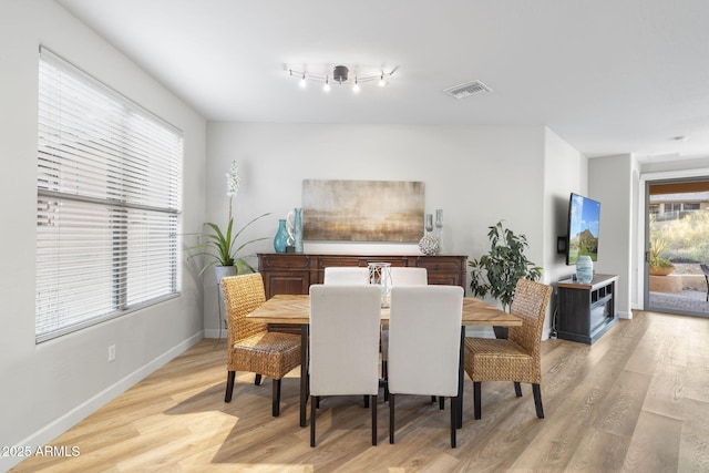 11400 E Helm Dr, Scottsdale, AZ 85255 - dining area featuring light wood-style floors and baseboards