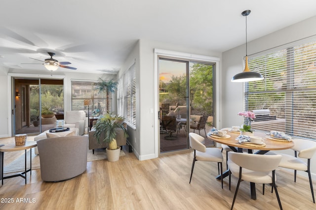 11400 E Helm Dr, Scottsdale, AZ 85255 - dining space with light wood-type flooring, ceiling fan, and baseboards