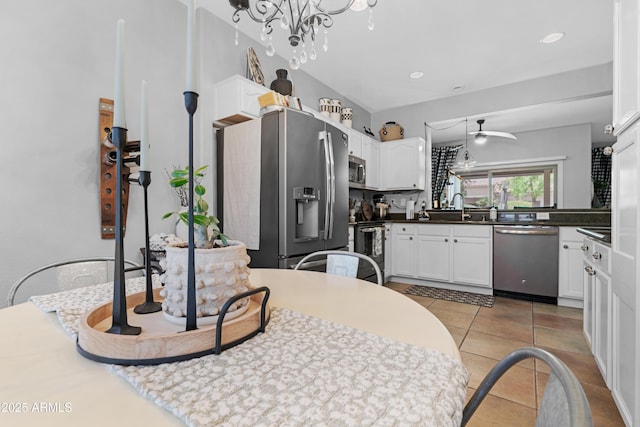 15971 W Indigo Ln, Surprise, AZ 85374 - kitchen featuring stainless steel appliances, a ceiling fan, white cabinetry, light tile patterned floors, and recessed lighting