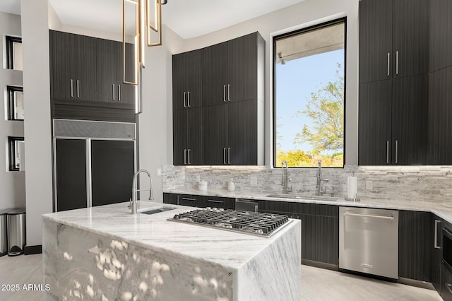 3282 E Palo Verde Dr, Paradise Valley, AZ 85253 - kitchen with decorative light fixtures, sink, stainless steel appliances, and a center island with sink