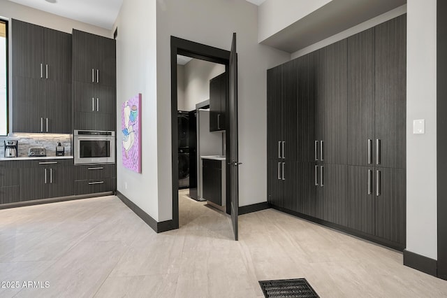 3282 E Palo Verde Dr, Paradise Valley, AZ 85253 - interior space with stacked washer and dryer
