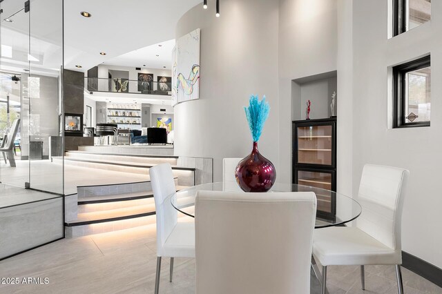 3282 E Palo Verde Dr, Paradise Valley, AZ 85253 - dining area featuring light tile patterned floors and a fireplace