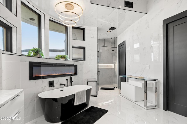 3282 E Palo Verde Dr, Paradise Valley, AZ 85253 - bathroom with tile walls, elevator, and plus walk in shower