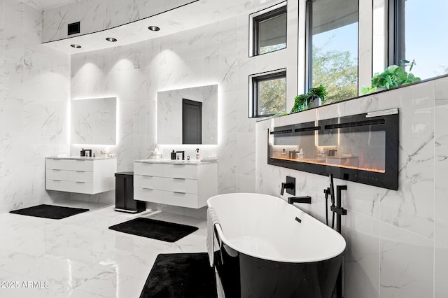 3282 E Palo Verde Dr, Paradise Valley, AZ 85253 - bathroom featuring vanity, tile walls, a fireplace, and a tub