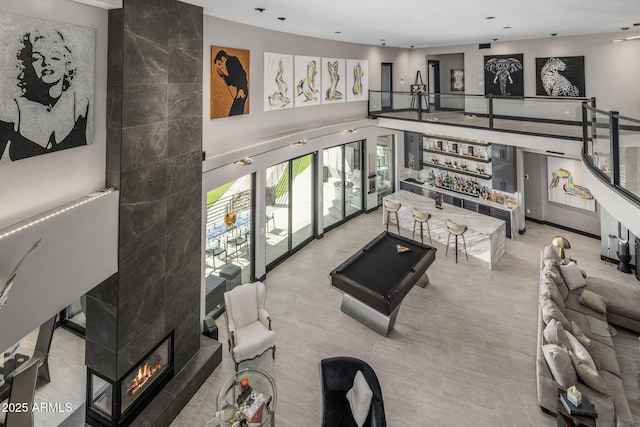 3282 E Palo Verde Dr, Paradise Valley, AZ 85253 - living room with billiards, a high end fireplace, and bar