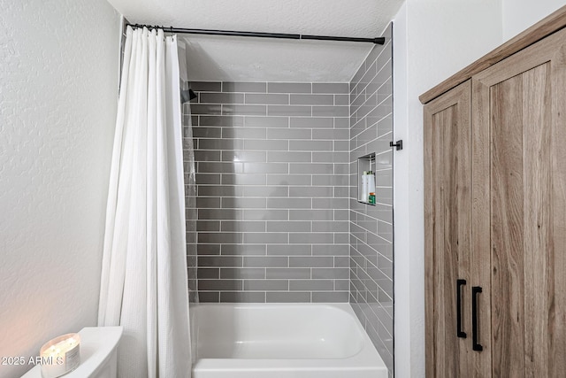 bathroom with toilet, a textured ceiling, shower / tub combo with curtain, and a textured wall