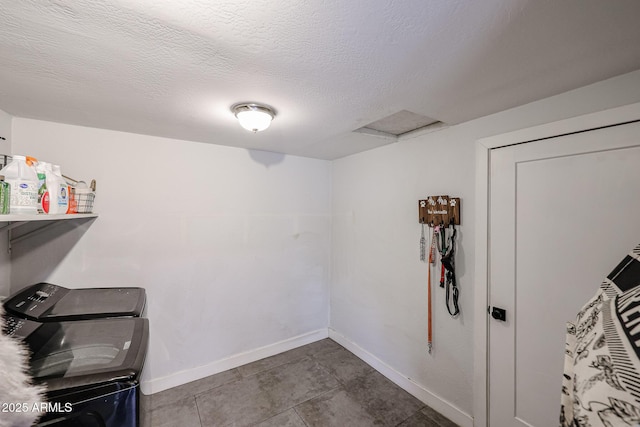 storage featuring attic access and separate washer and dryer