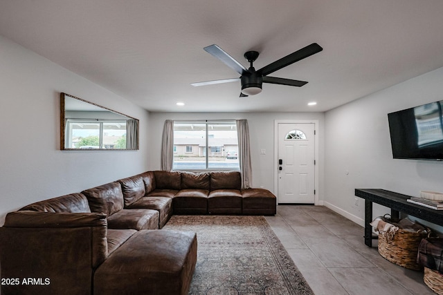 living room with a ceiling fan, recessed lighting, light tile patterned flooring, and baseboards