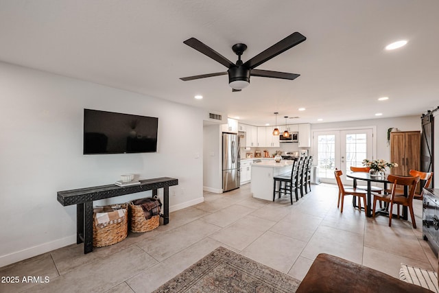 living room with recessed lighting, ceiling fan, baseboards, and french doors