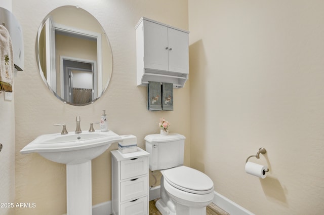 bathroom with toilet and sink