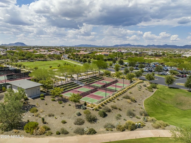 birds eye view of property with a mountain view