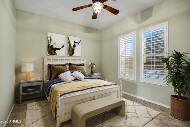 bedroom featuring ceiling fan and baseboards