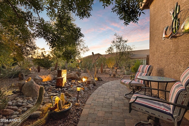 view of patio terrace at dusk