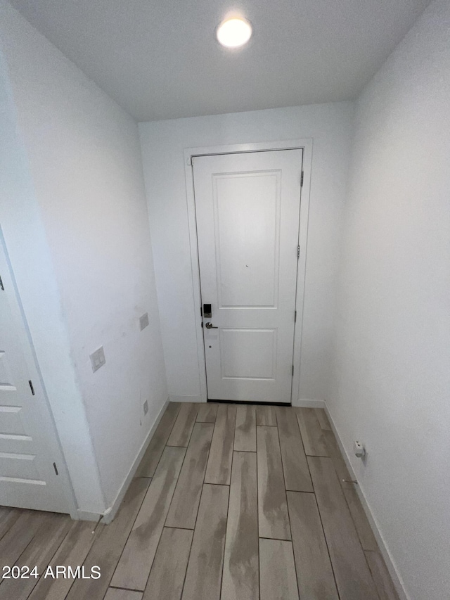 doorway with light hardwood / wood-style floors