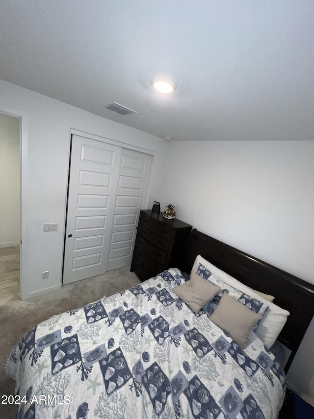 bedroom featuring a closet and carpet floors