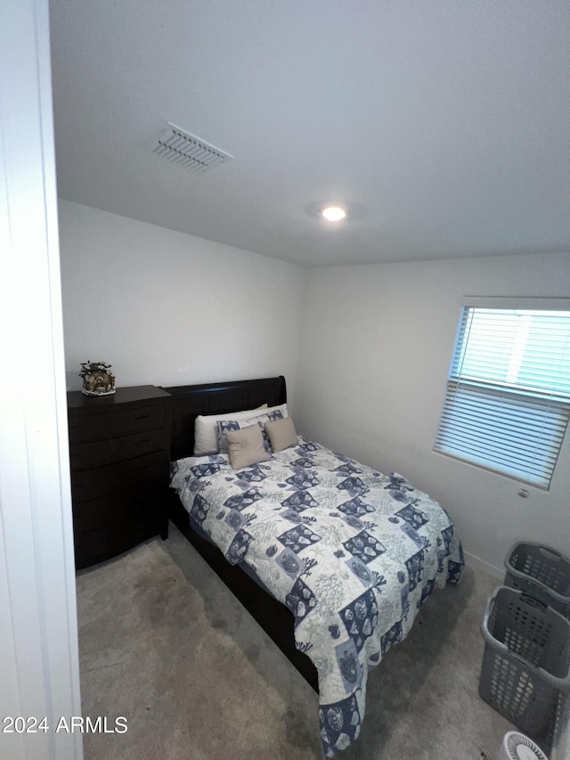 carpeted bedroom featuring vaulted ceiling