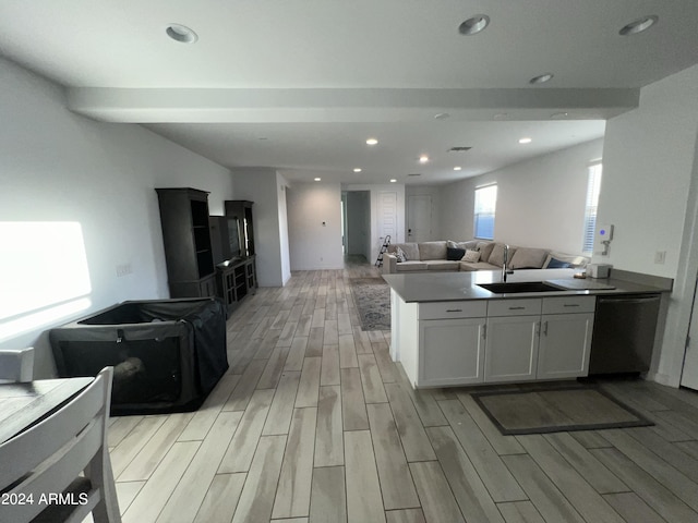 kitchen featuring dishwasher, white cabinets, and light hardwood / wood-style floors