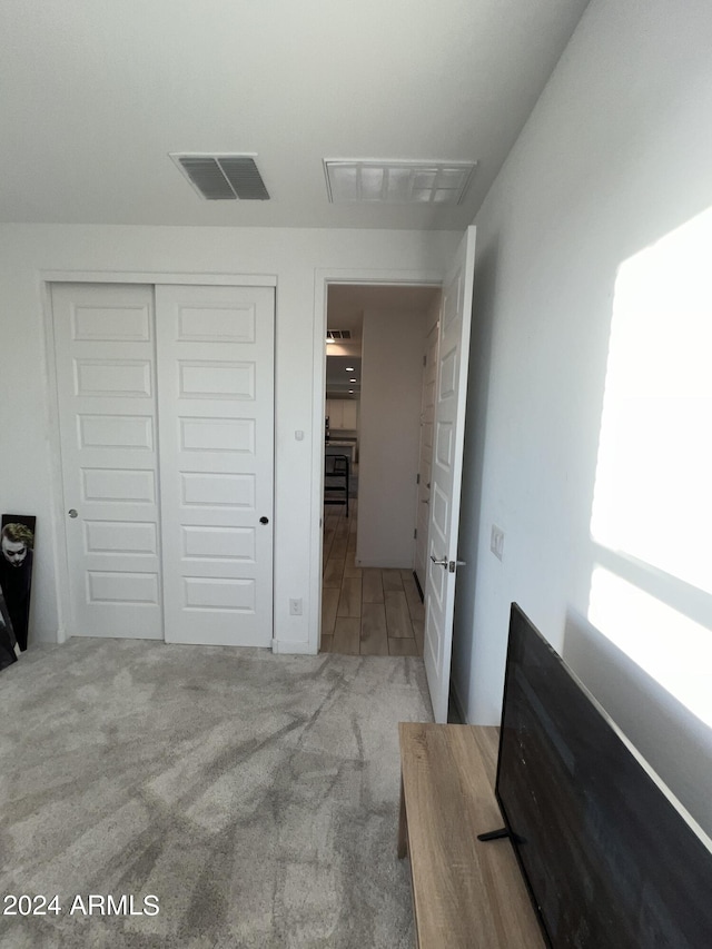 carpeted bedroom featuring a closet