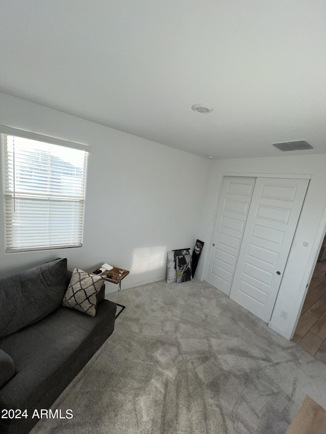 sitting room featuring carpet floors