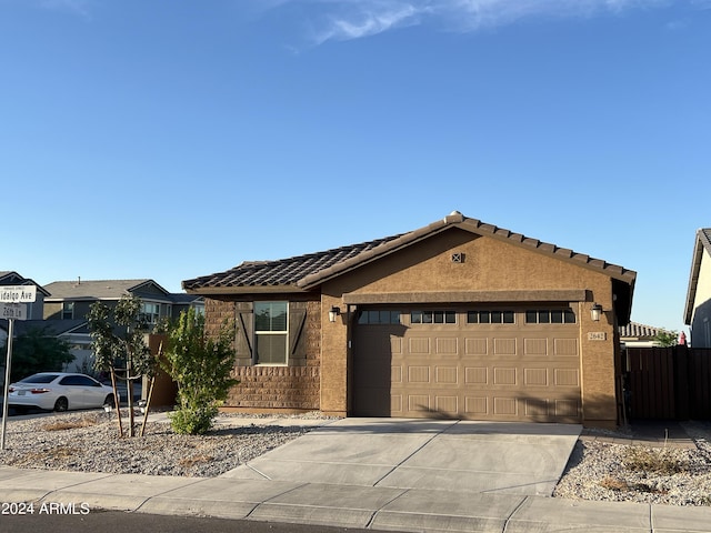 ranch-style home featuring a garage