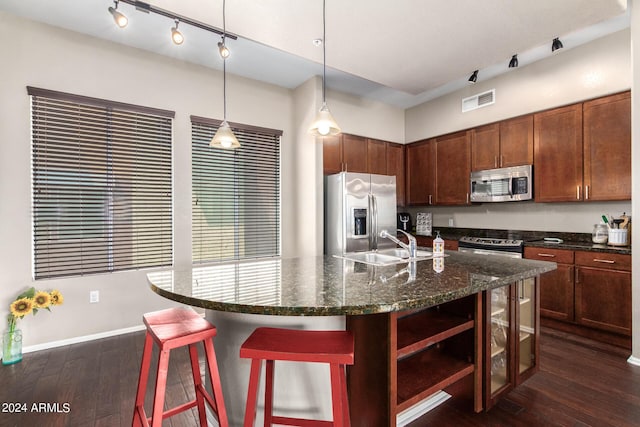 6745 N 93rd Ave Unit 1129, Glendale, AZ 85305 - kitchen featuring stainless steel appliances, dark wood finished floors, open shelves, a kitchen breakfast bar, and dark stone countertops