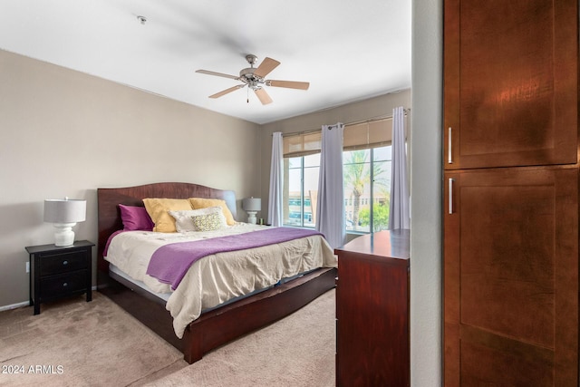 6745 N 93rd Ave Unit 1129, Glendale, AZ 85305 - bedroom with light colored carpet and ceiling fan