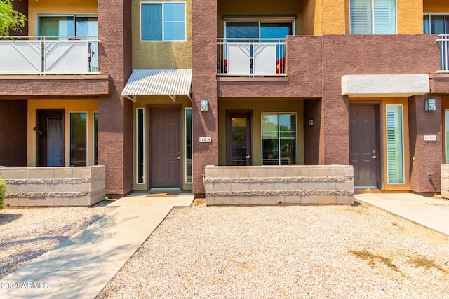 6745 N 93rd Ave Unit 1129, Glendale, AZ 85305 - view of exterior entry featuring stucco siding