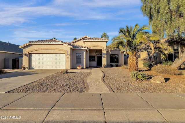 mediterranean / spanish-style house with a garage