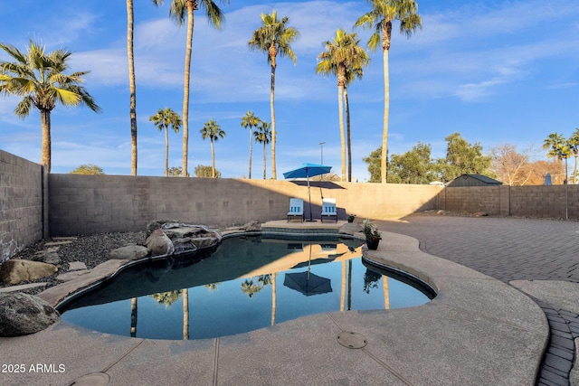 view of swimming pool with a patio