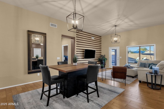 dining room with wood-type flooring