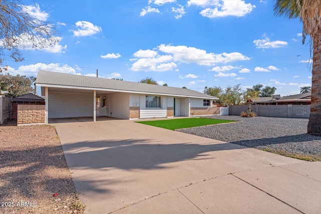 ranch-style home featuring a carport