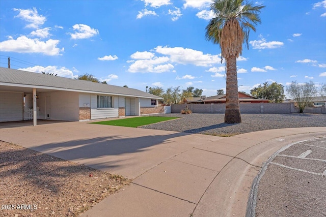 single story home featuring a carport