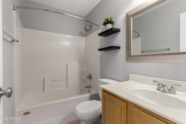 bathroom with shower / washtub combination, vanity, and toilet