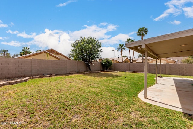 view of yard with a fenced backyard and a patio