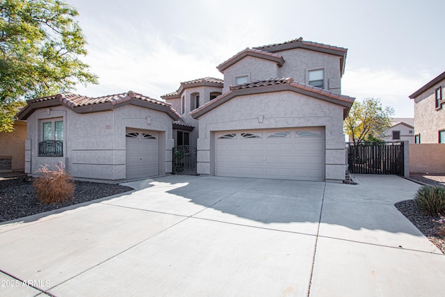 mediterranean / spanish home featuring a garage