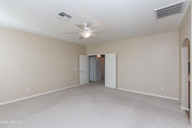 carpeted empty room featuring ceiling fan