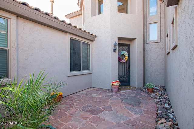 doorway to property featuring a patio area