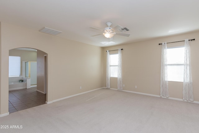 unfurnished room with carpet floors and ceiling fan