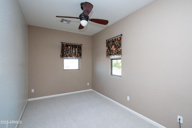 spare room with carpet flooring and ceiling fan