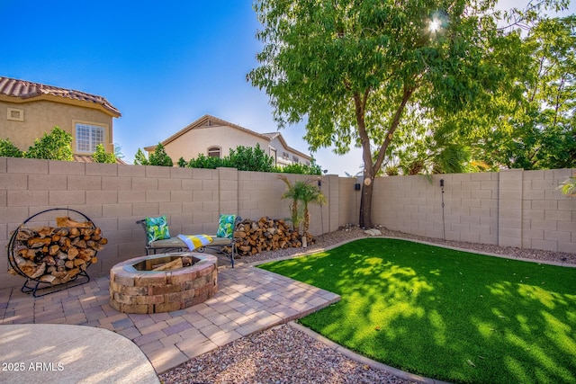 view of yard featuring a patio area and an outdoor fire pit