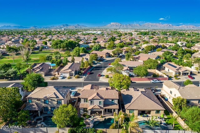 birds eye view of property with a mountain view