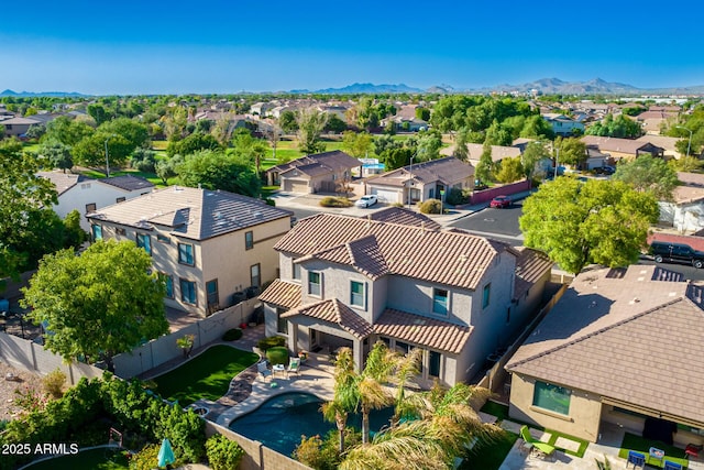 birds eye view of property with a mountain view