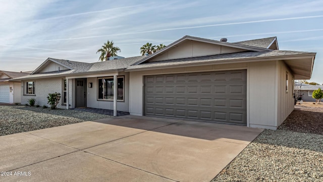 single story home featuring a garage