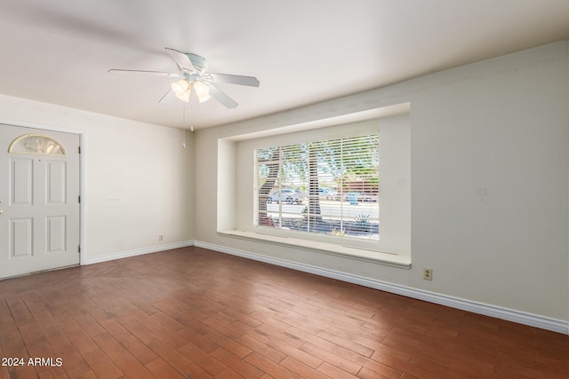 unfurnished room with hardwood / wood-style floors and ceiling fan