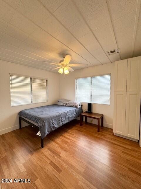 bedroom featuring ceiling fan and light wood-type flooring