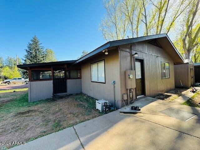 view of side of home with a patio