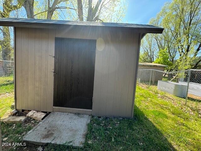 view of shed / structure with a yard